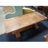 A solid oak low coffee table