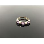 A 10ct gold diamond and amethyst ring,