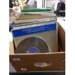 A box of LP records mainly classical