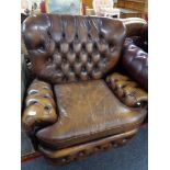 A Chesterfield style tan leather armchair