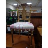 An antique style gilt hall chair