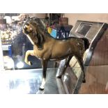 A Beswick horse, Head tucked, leg up, second version with tail straight down,