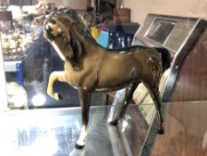 A Beswick horse, Head tucked, leg up, second version with tail straight down,