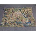 A wall tapestry depicting birds of paradise in a garden with mountains beyond CONDITION