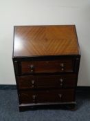 A late Victorian inlaid mahogany writing bureau