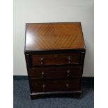 A late Victorian inlaid mahogany writing bureau