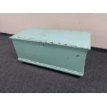 An antique painted pine blanket box