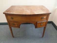 A George III mahogany D-shaped chest fitted three drawers with lion mask handles