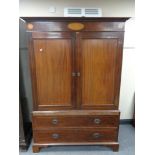 A Regency inlaid mahogany double door linen press converted to a wardrobe,