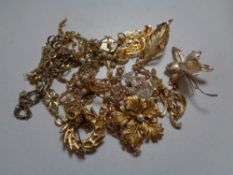 A box of gilt costume jewellery