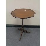 A Victorian mahogany wine table on three way pedestal