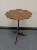 A Victorian mahogany wine table on three way pedestal