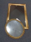 A late 19th century oval gilt composite framed mirror and a contemporary mirror