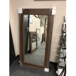 A brown contemporary flat framed mirror