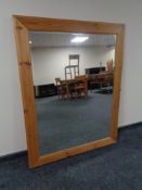 A large pine framed overmantel mirror