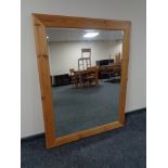 A large pine framed overmantel mirror