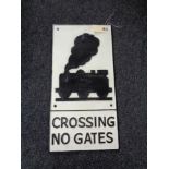 A metal Railway Crossing plaque