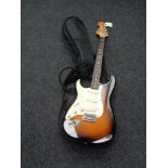 A Fender Squire Stratocaster left-handed electric guitar in carry bag