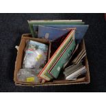 A box of postcards and postcards in books