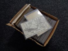 A box of twentieth century black and white & colour postcards