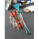 A set of mid century painted stool steps together with two bundles of walking sticks,