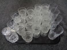 A tray of assorted drinking glasses and a lead crystal liqueur decanter