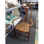 An inlaid mahogany bergere seated armchair