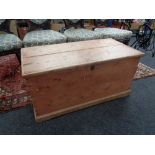 A stripped pine blanket chest