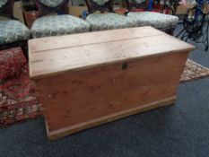 A stripped pine blanket chest