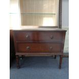 An Edwardian oak two drawer chest