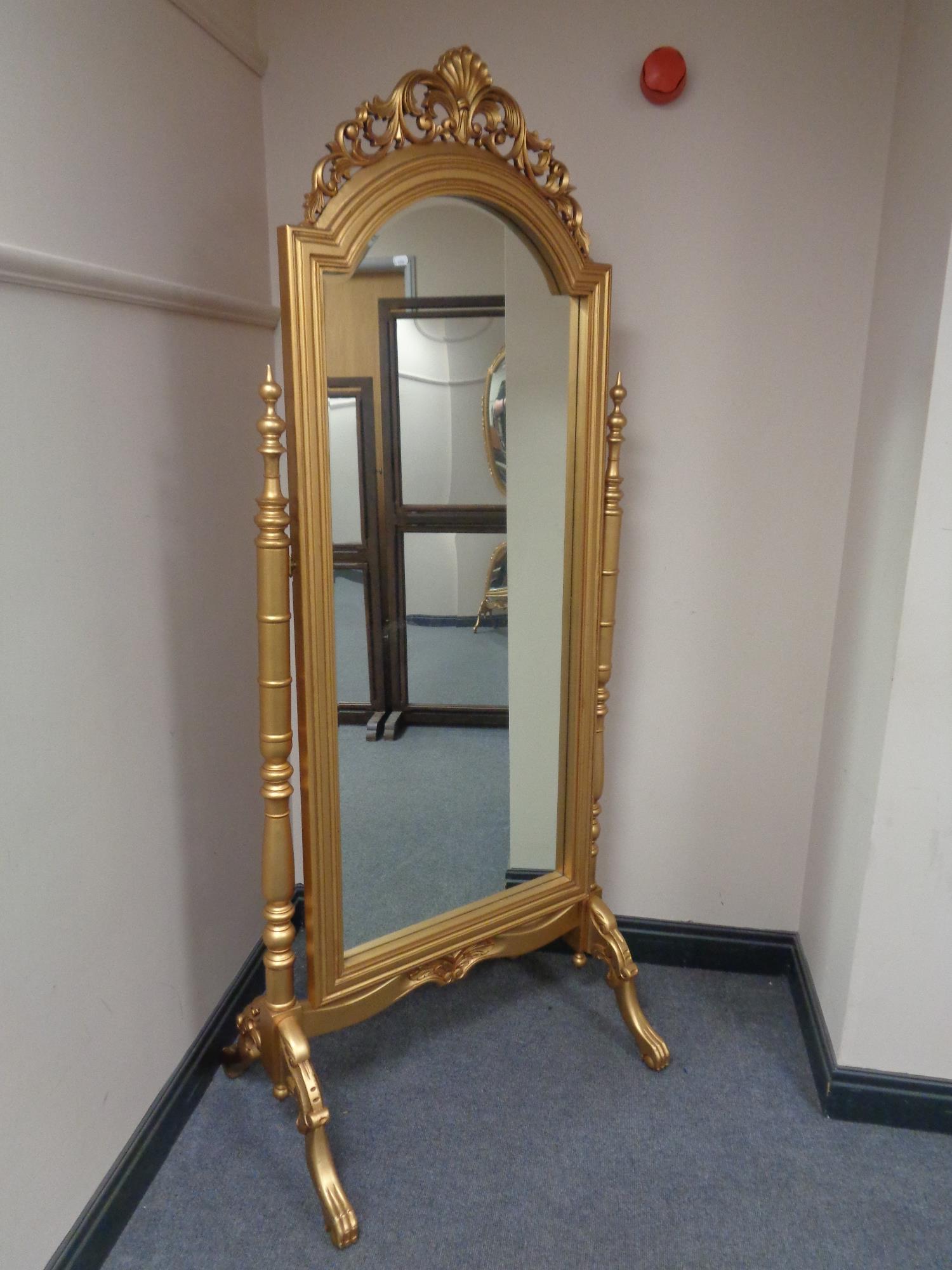 A 19th century style gilt cheval mirror.