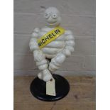 A metal figure - Seated Michelin man
