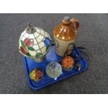 A tray of three glass paperweights, Tiffany style lamp with shade,