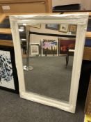 A contemporary white swept frame mirror 75 cm x 106 cm