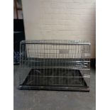 A folding dog cage,