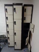 Three metal lockers (sixteen doors in total,