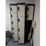 Three metal lockers (sixteen doors in total,