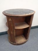 A Victorian mahogany oval book stand with blue leather inset panel
