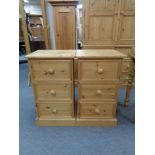 A pair of pine three drawer bedside chests