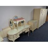 A six piece cream and gilt bedroom suite