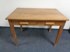 An Edwardian office table fitted two drawers