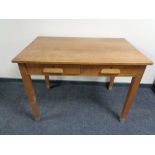 An Edwardian office table fitted two drawers