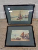 A pair of framed early 20th century watercolours depicting boats in a harbour and figures bringing