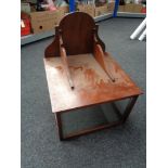 An antique mahogany display cabinet wall shelf