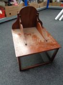 An antique mahogany display cabinet wall shelf