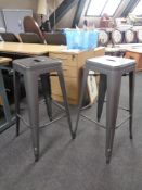 Two metal bar stools