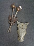 A pair of Spanish Toledo swords in carved wooden shield together with a metal horse mask