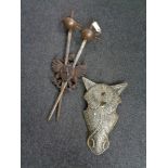 A pair of Spanish Toledo swords in carved wooden shield together with a metal horse mask