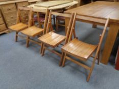 Four folding mid 20th century chairs