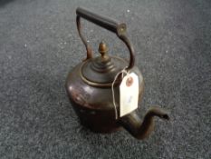 An antique copper kettle